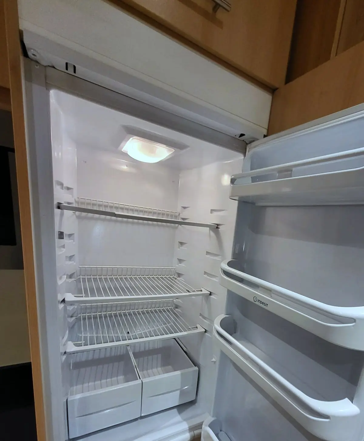 Fridge interior after cleaning, shelves and drawers empty